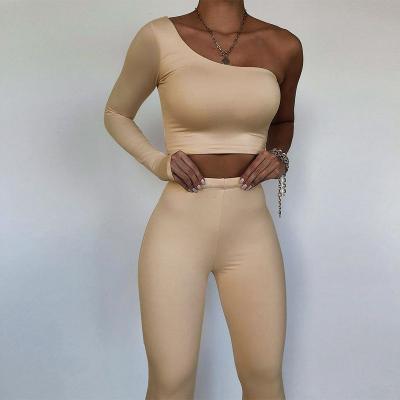 China 2022 Fashion Women's QUICK DRY Shoulder Sets Asymmetric Solid Two Piece Tops+Elastic Two Piece Crop Tops Casual Sporty Matching Suits for sale