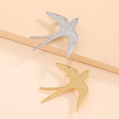 China Hot Sale Fashionable Stainless Steel Gold Plated Swallow Drawing Brooch Pins Quality Simple Brooches For Women Jewelry Gift for sale