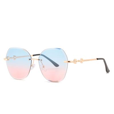 China Frameless cut-out sunglasses 9228 new fashion sunglasses European and American sunglasses women's ocean fashion fashion border sunglasses for sale