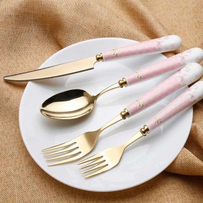 China Durable Ceramic Handle Gold Flatware Set 24 Pcs Stainless Steel Cutlery Set Porcelain for sale