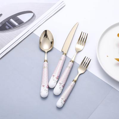 China Durable Cute Porcelain Handle Design Flatware Stainless Steel Cute Pink Gold Cutlery Set With Gift Box for sale