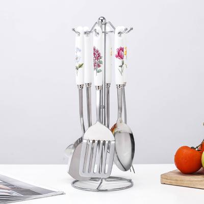 China Sustainable European Style Kitchen Ceramic Handle 7 PCS Stainless Steel Metal Cooking Cooking Utensils Set for sale