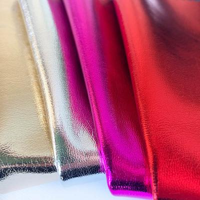 China Waterproof Fabric Imitation Metallic Leather Mirror PU Leather Synthetic Leather For Clothing For Jacket for sale