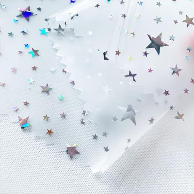 China Raincoat Faux Leather Waterproof Stars Laser Print TPU Leather For Kids Raincoat for sale