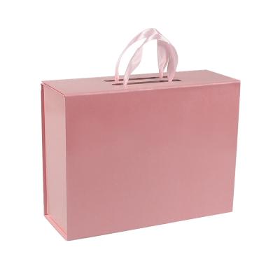 China Handmade Custom Printed Foldable Magnetic Closure Rigid Cardboard Paper Cosmetic Packaging Gift Box Pink With Corrugated Insert for sale