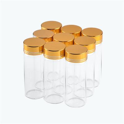 China 40ml Gift Glass Bottles Empty Transparent Clear Liquid Aluminum Screw Cap Gold Cap Gift Container Wishing Bottle Jars for sale