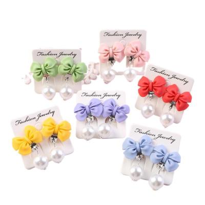 China Cute Cartoon Hot Girls Earrings Princess Bow Ear Clips Party Holiday Dance Gift Earrings for sale