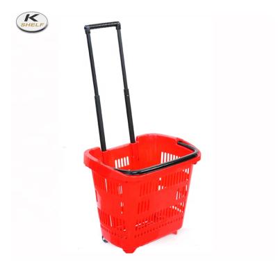 China Red Color Eco - Friendly Supermarket Plastic Shopping Basket On Wheels for sale