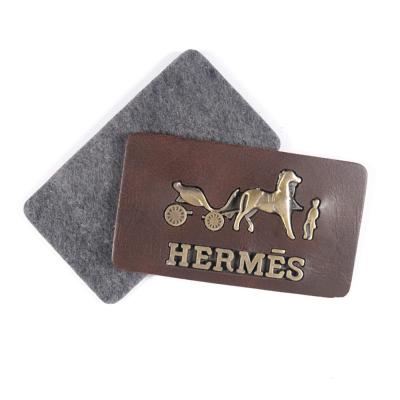 China Sustainable Garment Labels Custom Handbag Embossed PU Leather Label Jeans Patches With Design Logo for sale