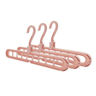 China Foldable Plastic Clothes Hanger 9 Holes Multifunctional Rotating Space Saving Wardrobe Hangers for sale