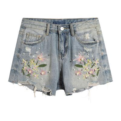 China Breathable Exquisite Unique Embroidered Special Flower Bead Cut Burr Denim Shorts for sale