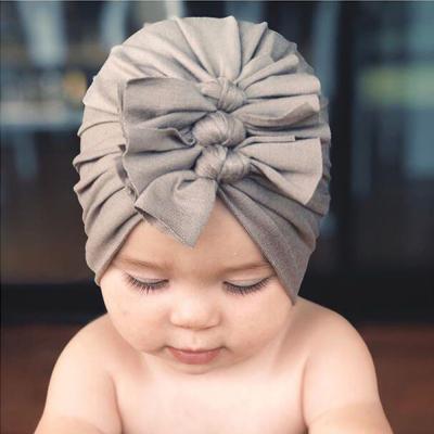 China COMMON fashion cotton soft plain and stripes newborn baby, hospital hood knot hat toddler baby beanie hat for sale