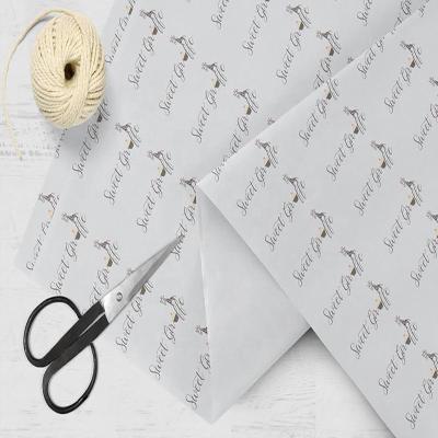 China Recycled Materials Customized Gloden Logo Black Packaging Paper Tissue Wrapping Paper For Products Packaging Clothes Wrap Tissue Paper Logo for sale