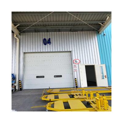 China Waterproof Industry Insulated Overhead Industrial Iron Sectional Door High Lift Lift Gate for sale