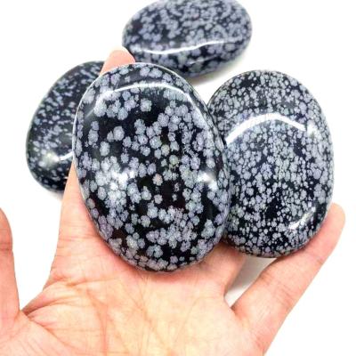 China Obsidiana Crystal Palm Stones de la nieve en venta