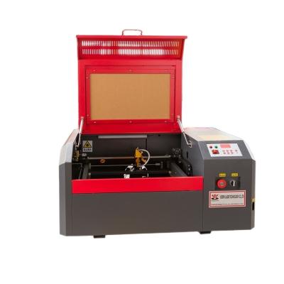 China laser engraving small mini laser engraver desctop laser engraving machine for wood and rubber stamp 3020/4040 stamp 40 50w for sale