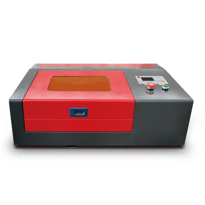 China Laser Engraving Small Mini Cheap CO2 Laser Engraver Laser Engraving Machine 3020 40w 50w For Leather Rubber Stamp for sale