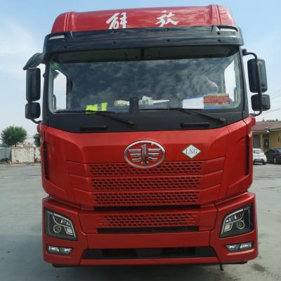 China Carbon Steel Cargo Box FAW Jh6 LNG Heavy Duty 530HP Tractor Truck with Air Suspension Seat for sale