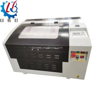 China Ubo 4040 Hot Sale CNC CO2 Laser Engraving Machine Full-enclosed Acrylic Wood Laser Cutting Machinery for sale