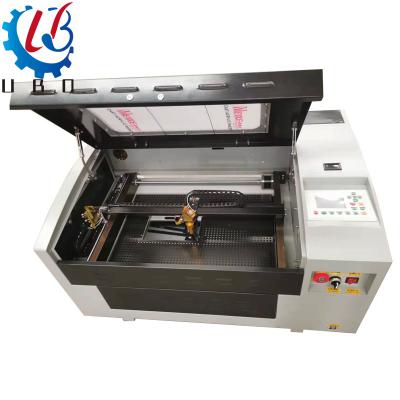 China mini co2 3d laser engraving machine ubocnc acrylic wood wood cutting machine 5030 Full-enclosed for sale