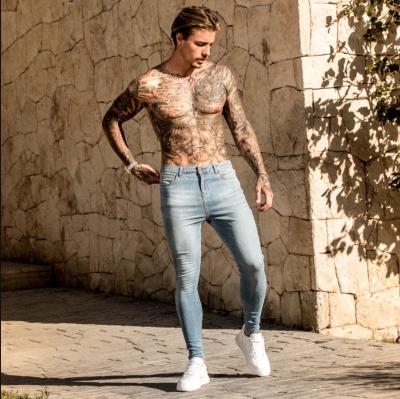 China 2022 Breathable European And American New Men's High-end Thin Ripped Pencil Pants New Tapered Jeans Men for sale