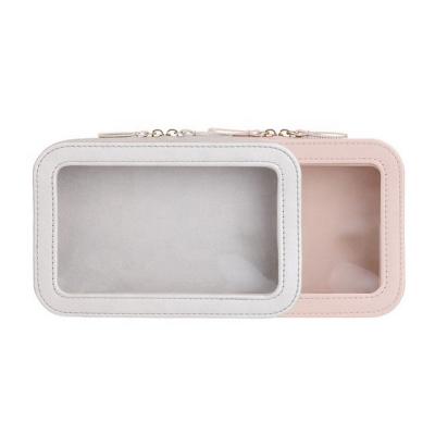 China Large Capacity Transparent Travel Bag Fashion Women Makeup Leather Cosmetic Bag for sale