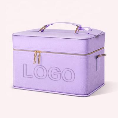 China Large Capacity Double Layer Cosmetic Bag With Handle Custom Logo Women Travel Leather Makeup Organizer Bag With Strap for sale