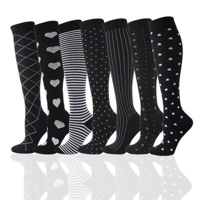 China Women Men Sustainable Compression Socks Elastic Sports Stockings Beautiful Leg Running Black White Classic Socks for sale