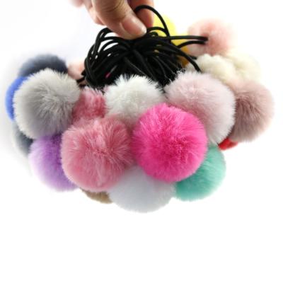 China smart casual kids elastic bands soft girl wear girls pom pom ponytail holder head children elastic faux pom tie fur band hair rope for sale