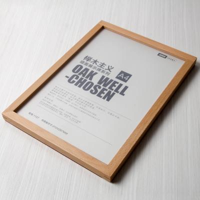 China Wall Mounted Simple Advertising Poster Frame Beech Acrylic Wood Snap In Photo Frame Wall Mounted Solid Wood A4 Frame for sale