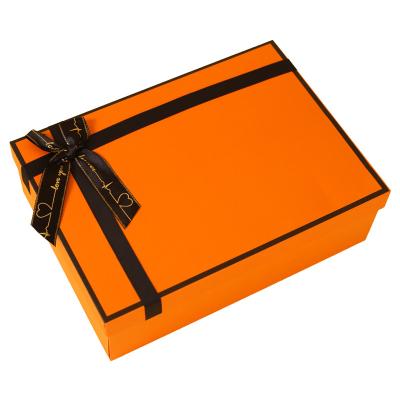 China Recyclable Custom Book Shape Orange Magnetic Lid Cardboard Foldable Kraft Paper Gift Box With Ribbon for sale