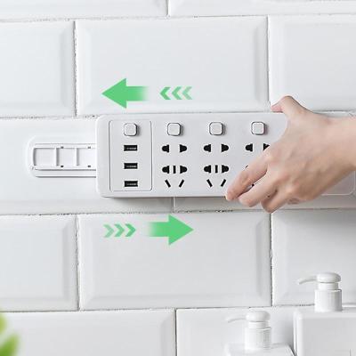 China Viable Seamless Punch Free Self Adhesive Socket Fixer Power Strip Holder Wall Desktop Storage for sale