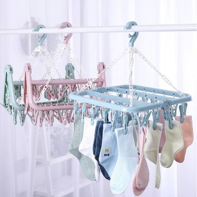 China Sustainable laundry underwear folding bra bangs dry hanger pp foldable hanging folding hanger with 32 clips for sale