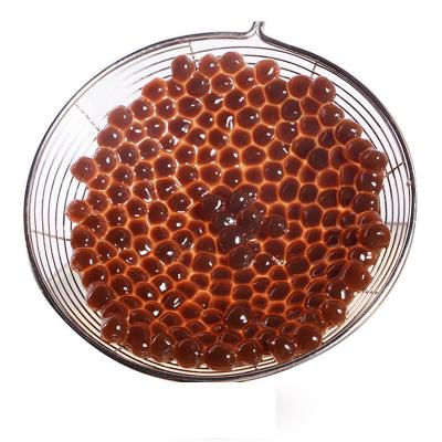 China Brown sugar cassava balls bubble tea supplies bubble tea shop factory direct big boba milk hair tapioca pearl granule for sale