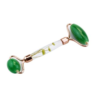 China Whitening New Design Beautiful Heart Flower With Green New Fashion Jade Roller With Flower Handle for sale