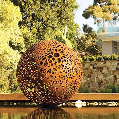 China Abstract Hollow Out Sphere Corten Steel Sculpture Metal Art Statues for sale