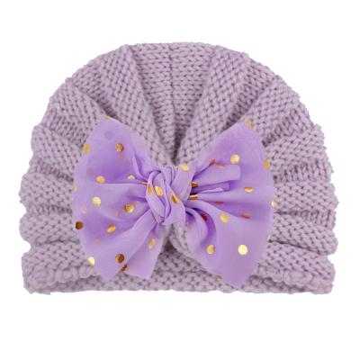 China New Autumn and Winter Knitted Children's Hats JOINT Baby Winter Wool Knitted Hats Bowknot Pom Pom Beanie Hats for sale