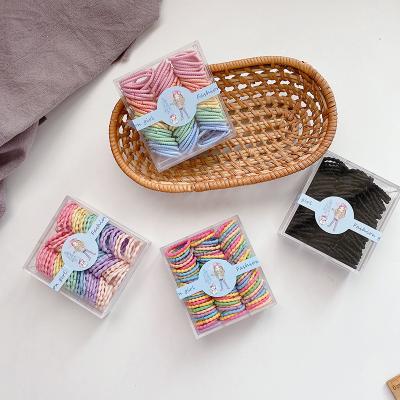 China Fashion 100 Pieces Korean Cute High Elastic Girl's Hair Rope Elastic Band Finger Hair Circle Small Children Candy Color Box for sale