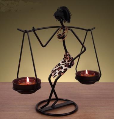 China Creative African Girls Iron Figure Candle Holder for Home Decoration for sale