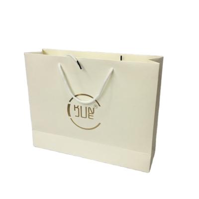 China Recycled Materials Wholesale Custom Printed Luxury Hot Foiled White Foiled Shopping Paper Gift Bag With Cotton Rope Handle for sale