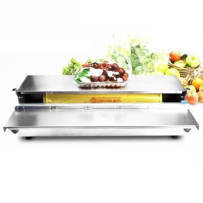 China Hand Manual Food Vegetable Fish Meat Plastic Cling Film Tray Wrapping Machine for sale