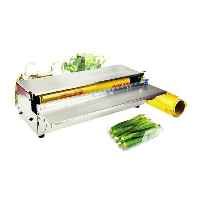 China Vegetable Food Manual Meat Stretch PVC Cling Film Tray Packaging Machine for sale