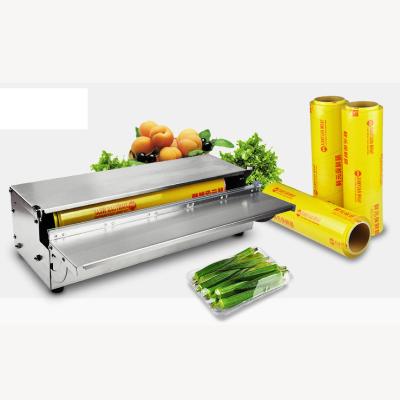 China 2020 Food Manual Fruit And Vegetable Tray Cling Wrapping Film Machine For Super Market Application for sale