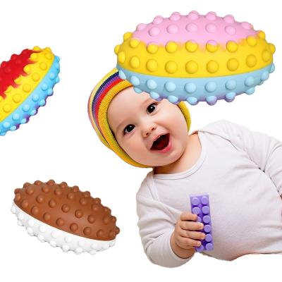 China Eco-Friendly Materials Relaxation Silicone Snap Ball Push Bubble Wiggle Sensory Doll Rugby Stress Balls 3D Wiggle Oval Balls for sale