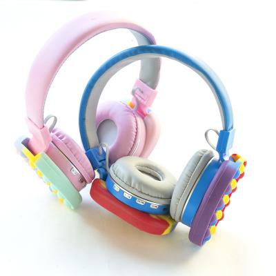 China Cute Stereo Silicone Earphone Rainbow Birthday Gift Headset Bubble Press Relax Restless Person Toys for sale