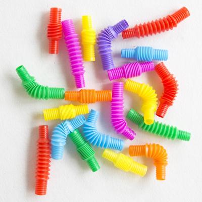 China Mini Pop Tubes Sensory Colorful Stretch Decompression Pipe Eco-Friendly Plastic Toys Plastic Noise Tube Toys For Kids Stir Tube for sale