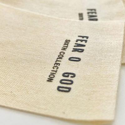 China Fashionable Simple Beige Silicone Cotton Labels 3D Labels Fashionable End Fold Label Clothes Accessories for sale