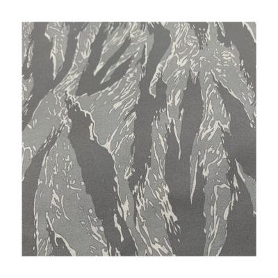 China 100%Polyester Waterproof Camouflage Softshell Dewspo Bonded Fabric Softshell Fabric For Jacket for sale