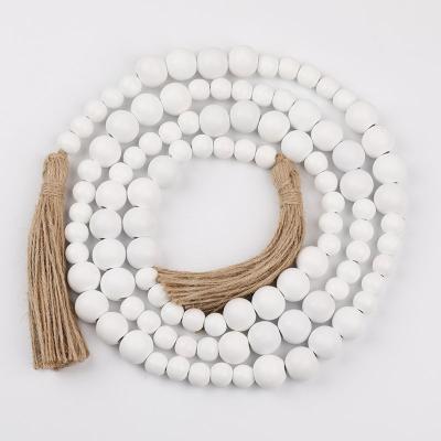 China Art Deco White Wooden Bead String Hanging Wood Beads Garland with Rustic Burlap Tassels for sale