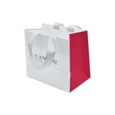 China Recyclable Custom Printed Shopping Bag Coated Gift Craft Apparel Kraft Paper Bag With Ribbon Handle for sale